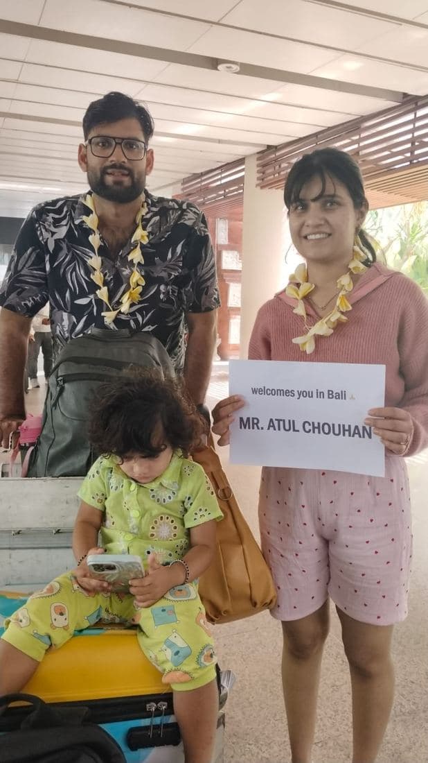 A family travelling with Trripah, welcomed at Bali airport with flower garlands