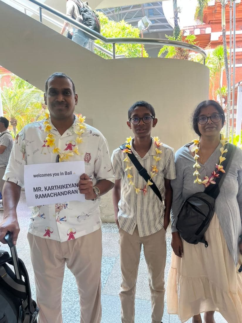 A family travelling with Trripah, welcomed at Bali airport with flower garlands