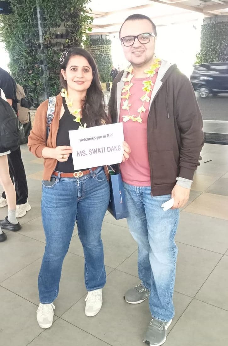 A family travelling with Trripah, welcomed at Bali airport with flower garlands