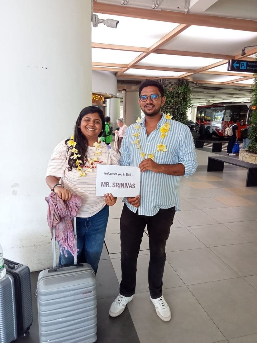 A family travelling with Trripah, welcomed at Bali airport with flower garlands