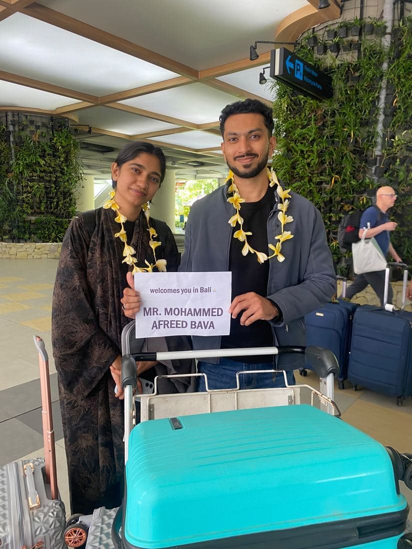 A family travelling with Trripah, welcomed at Bali airport with flower garlands