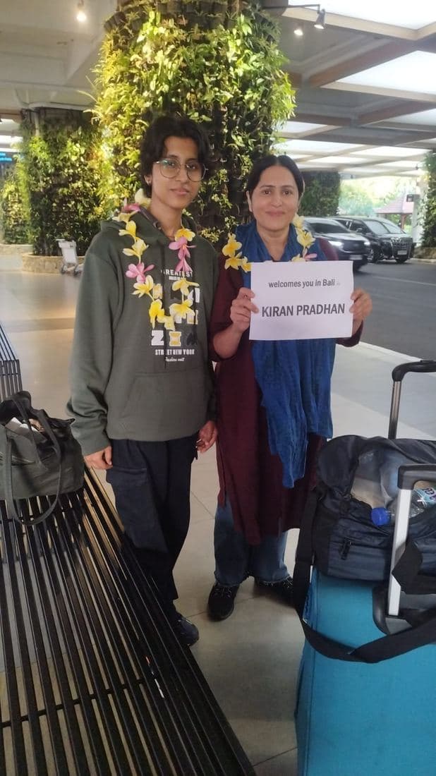A family travelling with Trripah, welcomed at Bali airport with flower garlands