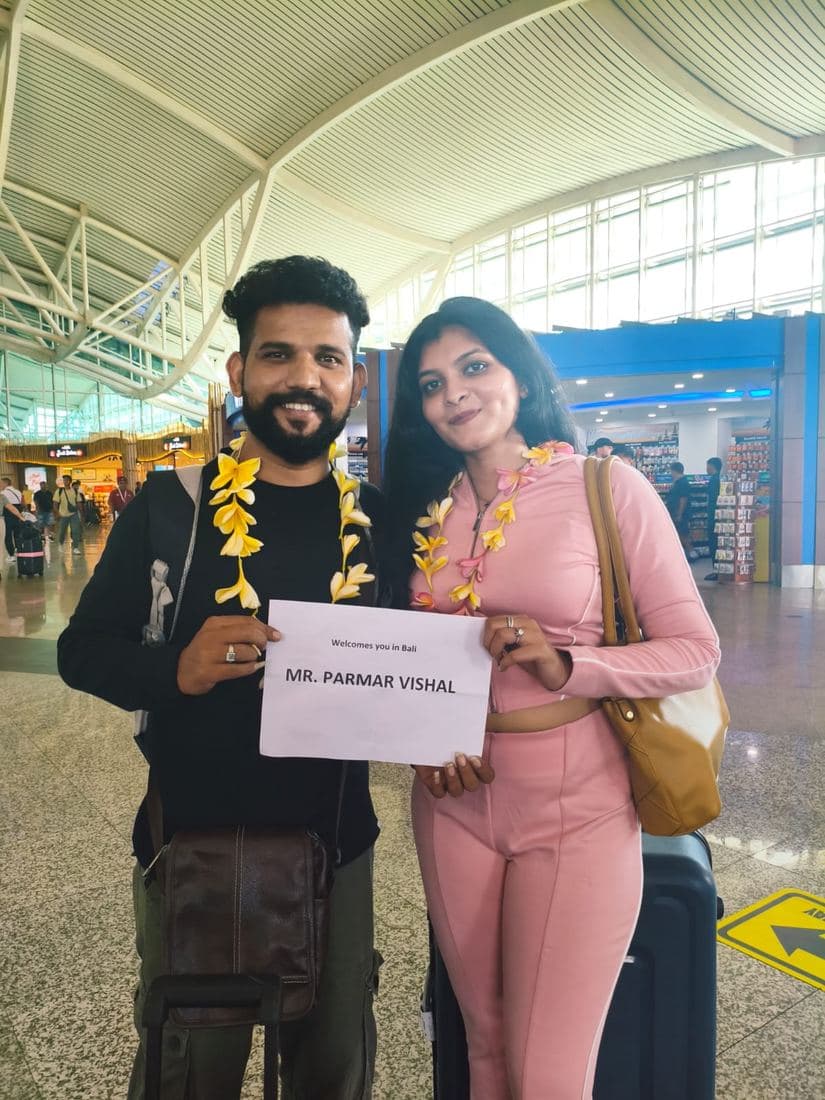 A family travelling with Trripah, welcomed at Bali airport with flower garlands