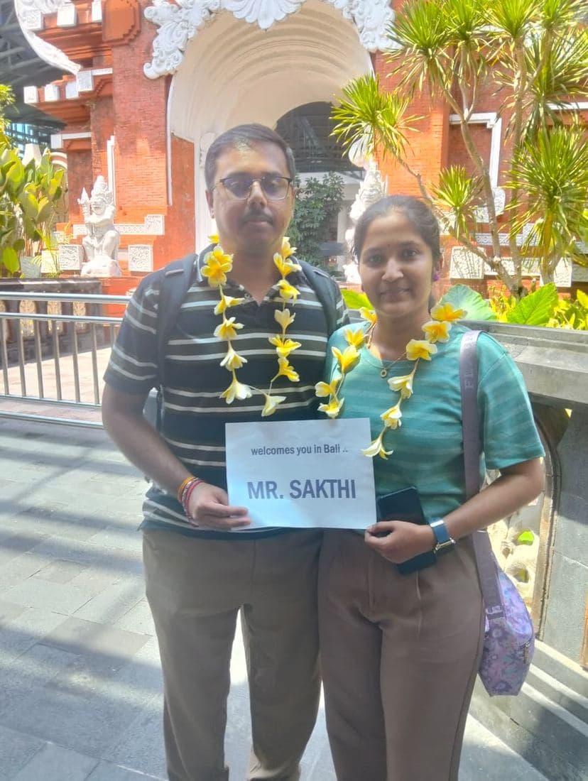 A family travelling with Trripah, welcomed at Bali airport with flower garlands